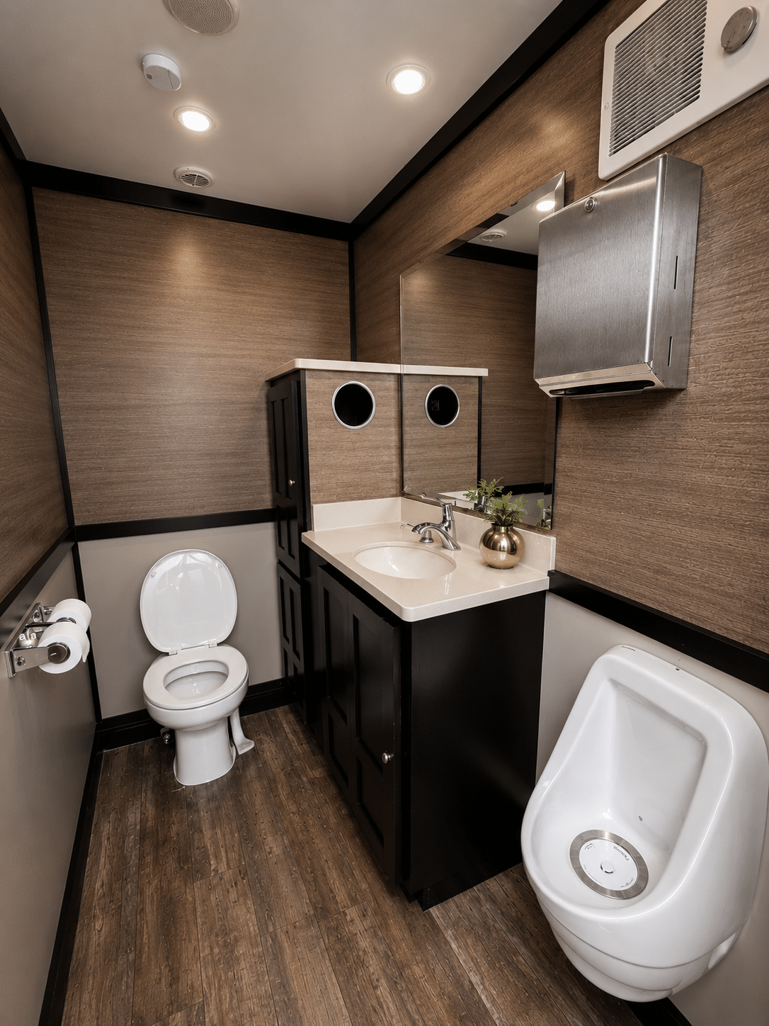 Premier Luxe Lounge Interior Luxury Restroom Trailer Luxury restroom trailer interior with modern vanity, flushing toilet, wood grain walls, and upscale finishes for weddings and events